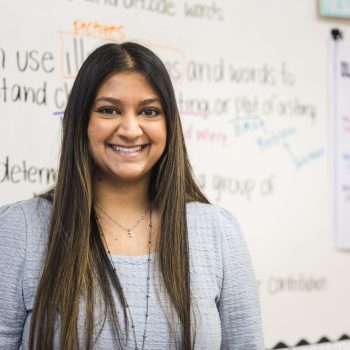 young teacher in front of board
